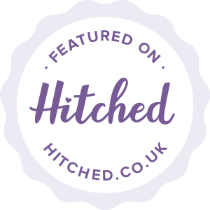 a white circle with purple text