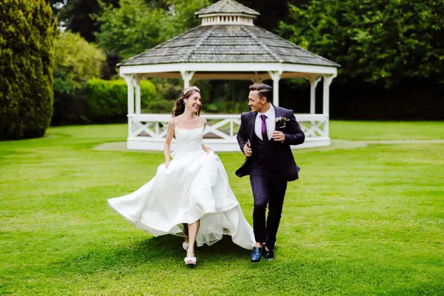 Running into married life like… 💨💍 Who needs a carriage when you’ve got love (and a good lawn for a dramatic jog)? #JustMarried #ClearwellCastleWeddings #RunningStart #WeddingDayJoy