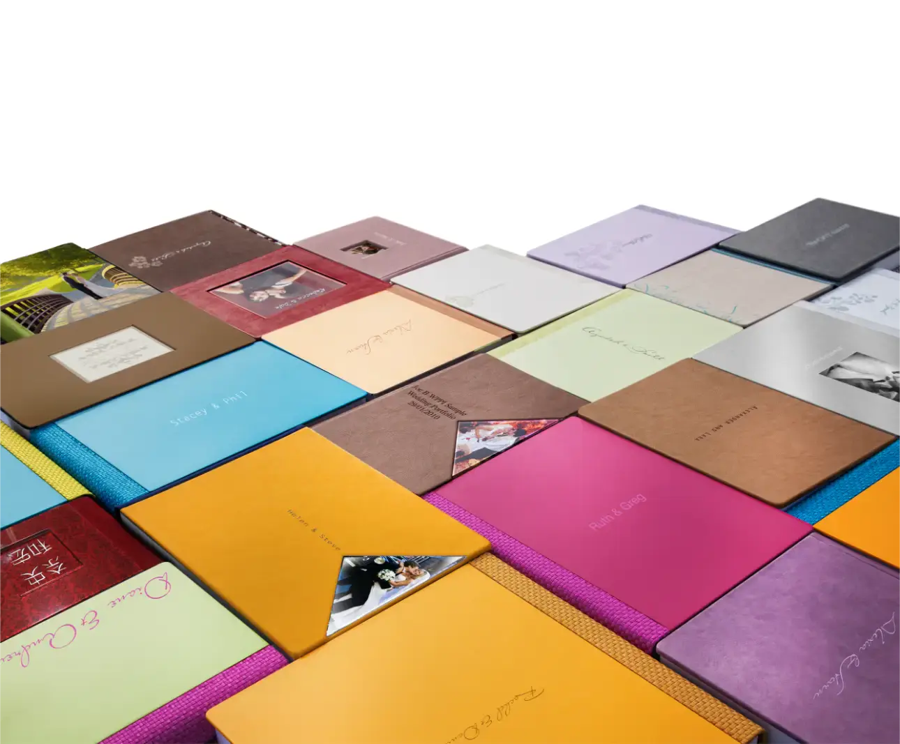 wedding albums layed out to see various designs and colours
