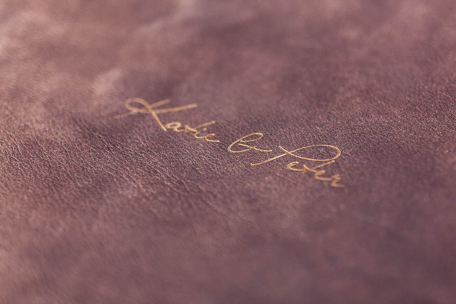 embossed leather logo detail of front of album